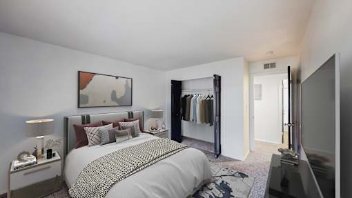 A bedroom with a large bed and a wardrobe.