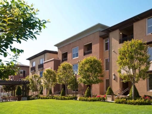 A building with a green lawn in front of it at Circa 37 Apartments, San Diego, 92108