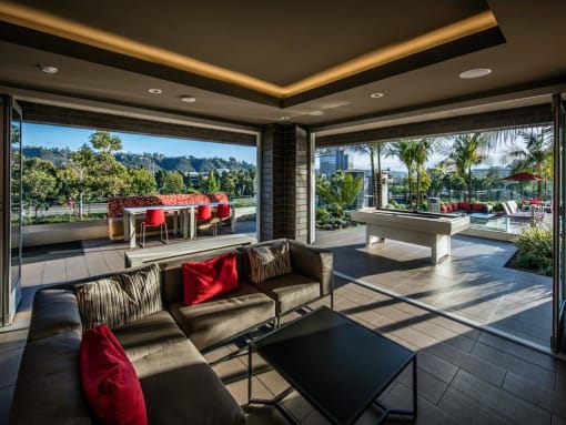 A modern living room with a view of the outdoors at West Park Apartments, San Diego, CA
