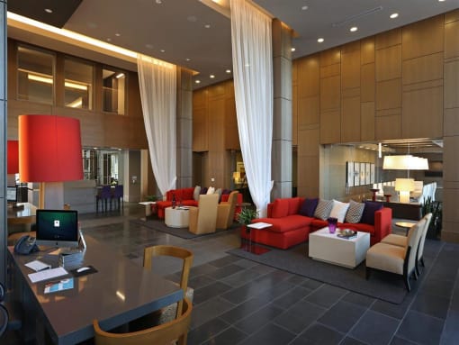 A hotel reception area with a desk and chairs at West Park Apartments, San Diego, California