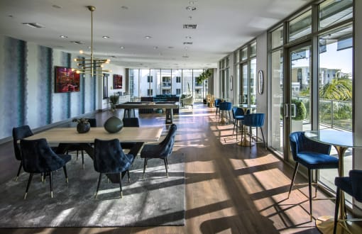 A large dining room with a long table and chairs at Circa 37 Apartments, San Diego, California