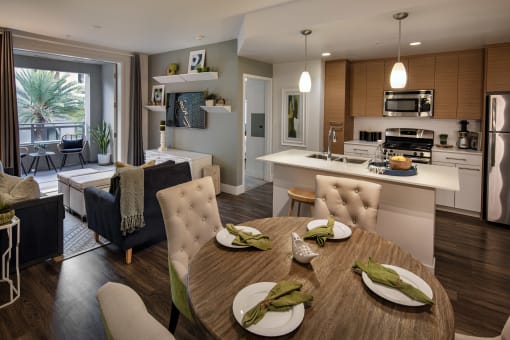 A modern dining room with a table set for two at West Park Apartments, San Diego, CA