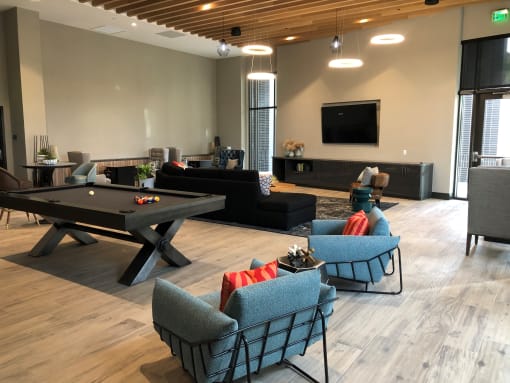 A room with a pool table and a television at Purl Apartments, California, 92108