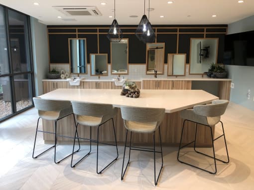 A modern dining room with a large table and chairs at Purl Apartments, San Diego, CA, 92108