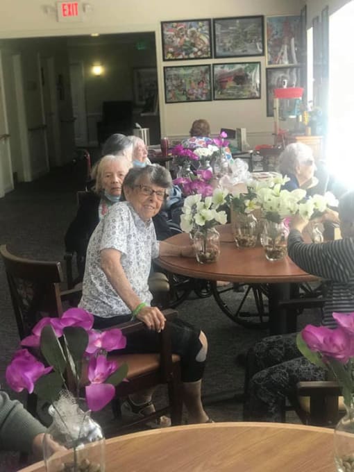 Seniors Seating With Flowers at Savannah Court of Brandon, Florida, 33510