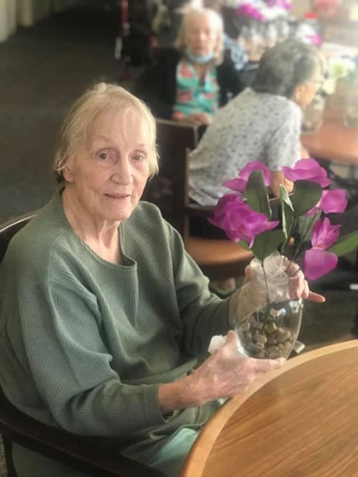 Senior Lady With Flowerpot at Savannah Court of Brandon, Brandon