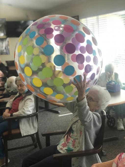 Senior Lady With Balloon at Savannah Court of Brandon, Florida