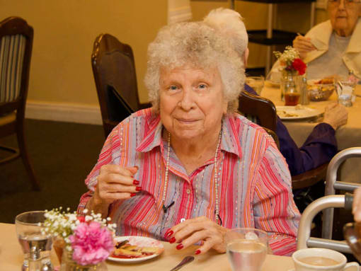 Lady eating at Savannah Grand of Sarasota, Sarasota, 34238