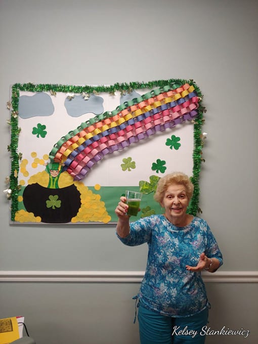 Senior Lady Poses With A Drink at Hibiscus Court, Melbourne, Florida