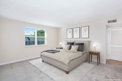 a bedroom with a bed and a window