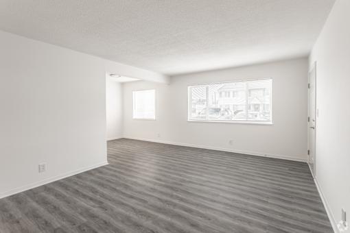 A room with a window and a door.