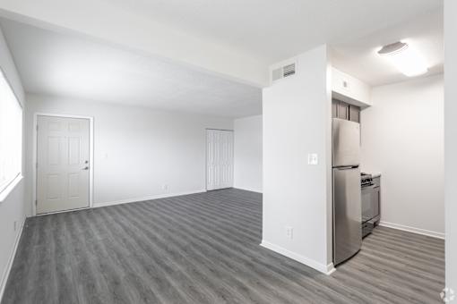 A kitchen area with a stainless steel dishwasher and oven.