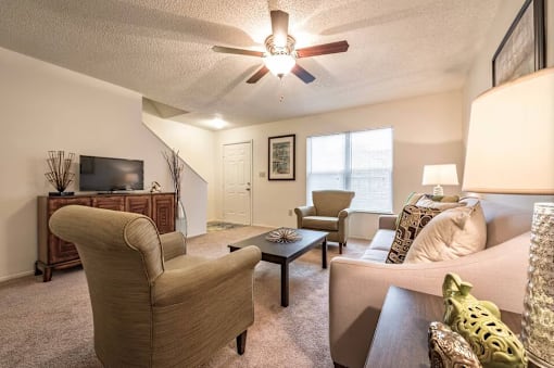 A living room with a brown chair and a brown table.