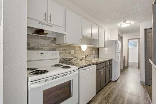 Kitchen With White Appliances at Carriage Hill, Colorado, 80260
