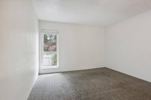 Vacant Room with Carpeted Floor at Lakeridge Terrace Apartments, Denver, CO