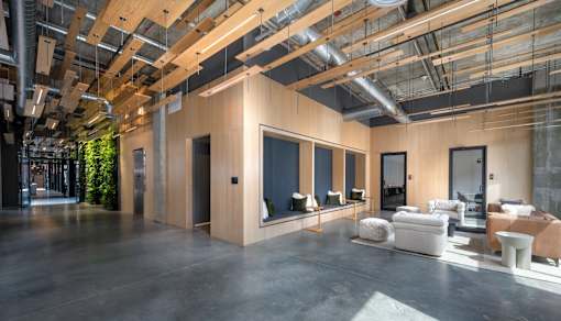 a large living room with large windows and a concrete floor at The Audubon New Haven, New Haven, CT