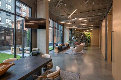 the interior of a large office space with furniture and large windows at The Audubon New Haven, New Haven, Connecticut