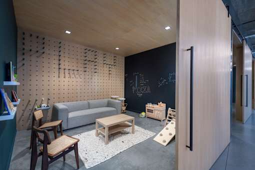 a living room with a couch and tables and a chalkboard at The Audubon New Haven, New Haven, CT, 06511