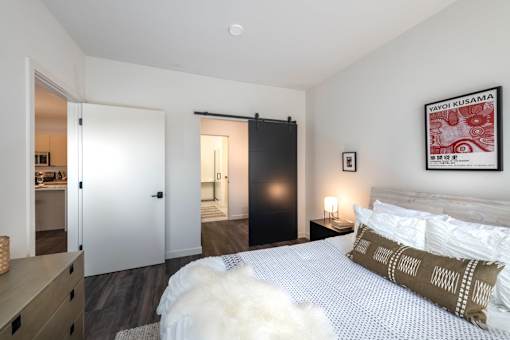 a bedroom with a bed and a closet at The Audubon New Haven, Connecticut, 06511