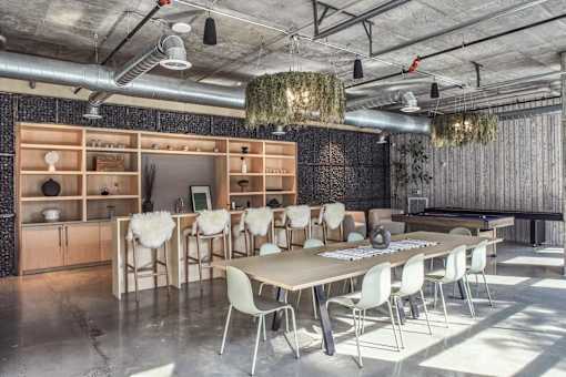 A conference room with a long table and chairs at The Anthem at Square 10 Apartments, New Haven, Connecticut