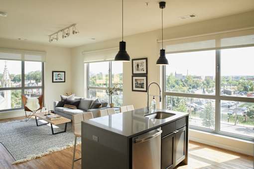 the living room and kitchen of an apartment at The Audubon New Haven, New Haven, 06511