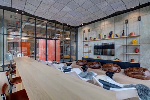 a rendering of a room with tables and chairs and glass walls at The Audubon New Haven, New Haven, CT, 06511