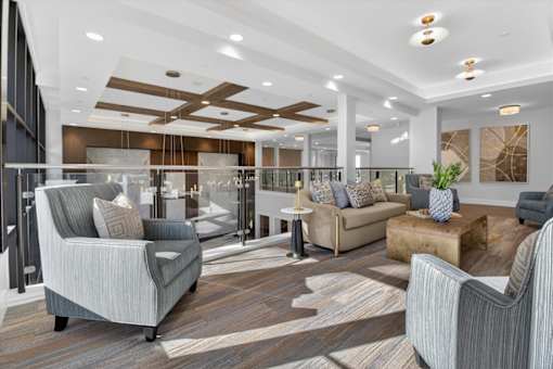 A modern living room with a grey sofa and a wooden coffee table.