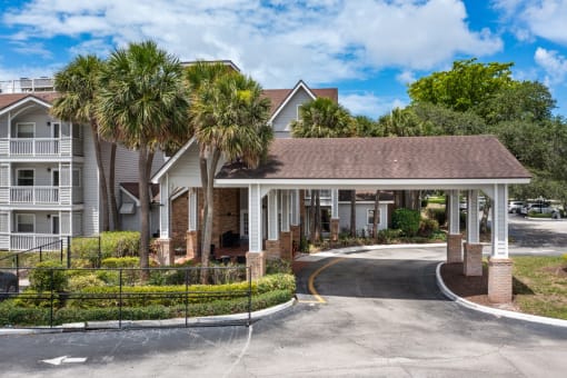 a building with palm trees in front of it