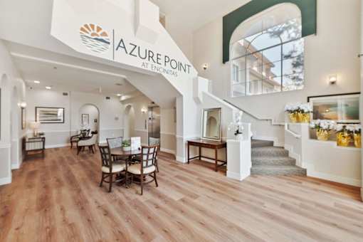 Azure Point at Encinitas interior with wood floors and furniture.