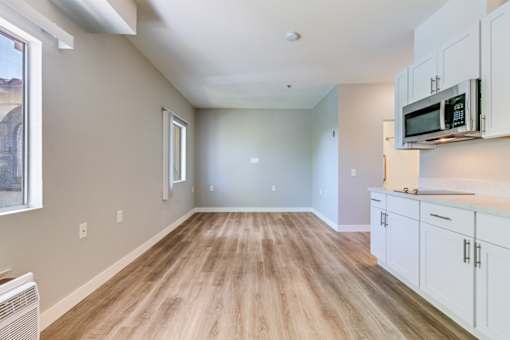 Kitchen with white cabinets at Azure Point at Encinitas - 55+ Active Adult Apartments, California, 92024