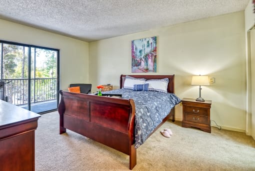 model bedroom with wooden queen bed frame