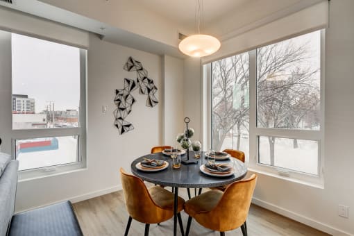 Dining Area with Large Windows and Designer Lighting  at Southpark, Edmonton, T6E 3S3