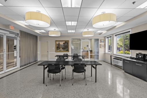 a conference room with a large table and chairs