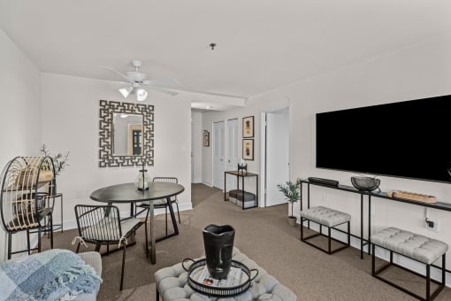 a living room with a couch and a table and a television
