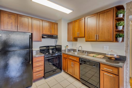 a kitchen with stainless steel appliances and wooden cabinets