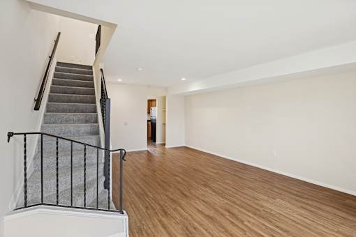 Maplewood Villas Apartments Unit Living space with stairs 26