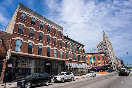 A street view of a city with cars and buildings.