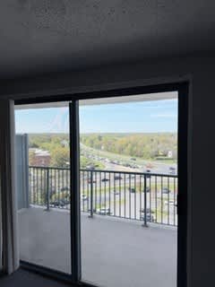 A view of a parking lot from a window.