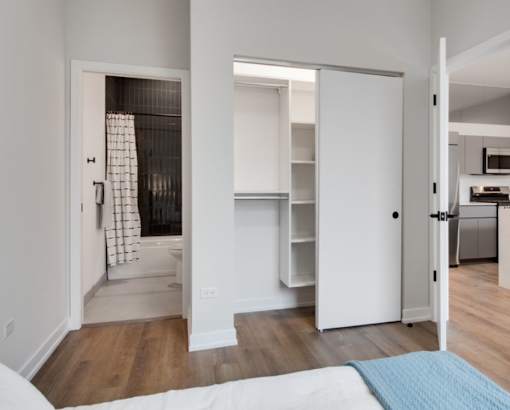 a bedroom with a bed and a closet