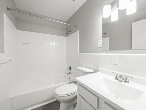 a bathroom with a sink toilet and bathtub
