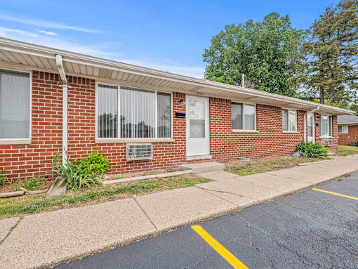 a brick building with a white door