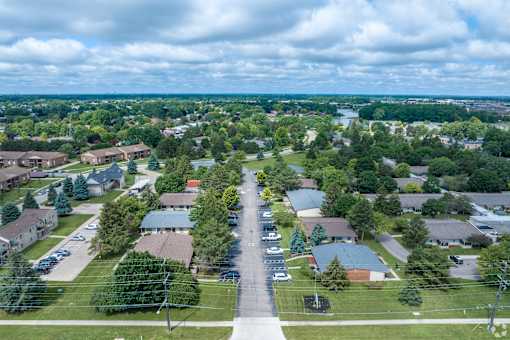 an aerial view of a neighborhood with houses and trees