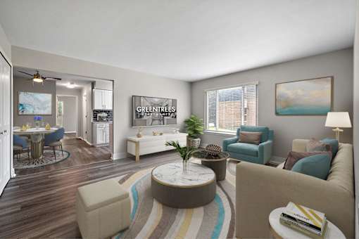 A living room with a sofa, chairs, and a coffee table.