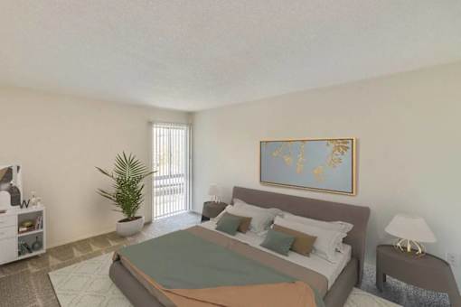A bedroom with a bed, nightstand, and a plant.