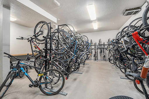 A bike parking room with many bikes.