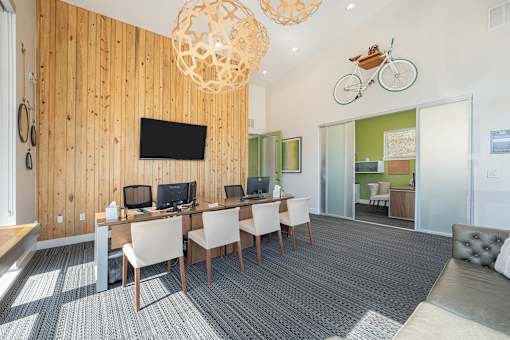 A room with a wooden wall and a television mounted on it.