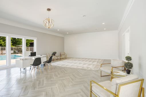 a living room with a dining room and a pool