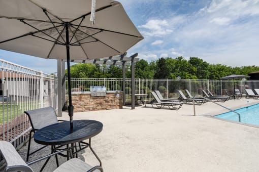 our 2400 2400 patio has a pool and chairs and umbrella