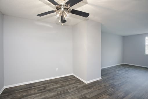 a room with a geometric wall and wood floors
