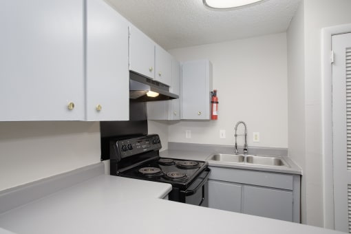 the preserve at ballantyne commons apartment kitchen with stove and sink